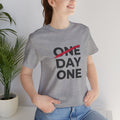 “Day One” Unisex Tee - Black Text